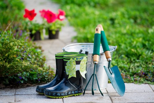Gardener loading garden waste for transparent Mottingham pricing