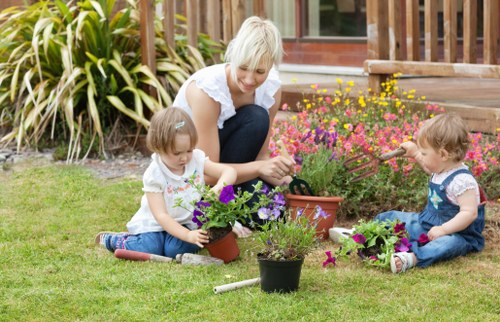 Landscape gardening in Mottingham with a stylish patio and planting beds
